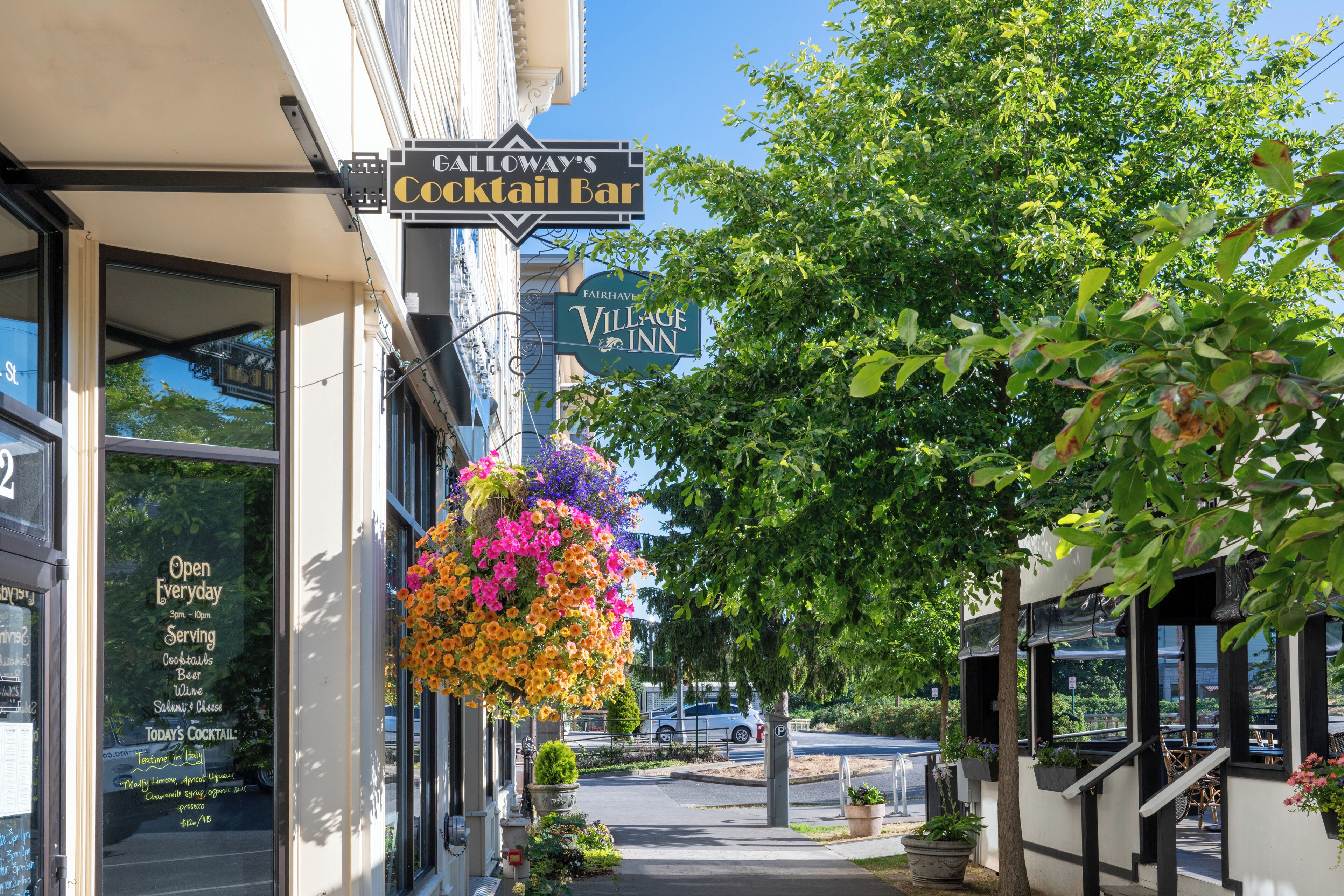 A street view with a building labeled "Village Inn" and a sign for "Galloway's Cocktail Bar" above the entrance.