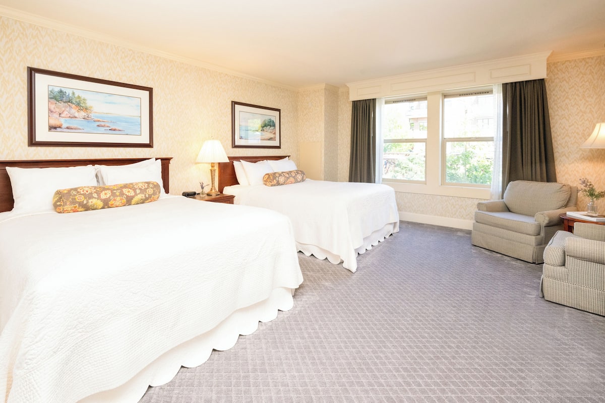 Premium bedding, desk, laptop workspace, blackout drapes