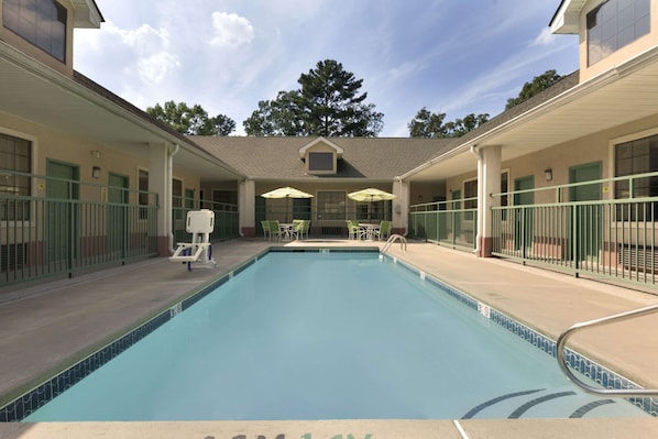 Seasonal outdoor pool, pool loungers