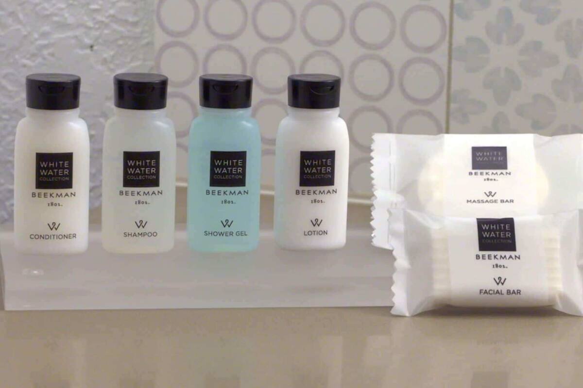 A display of White Water Collection products including conditioner, shampoo, shower gel, and lotion.