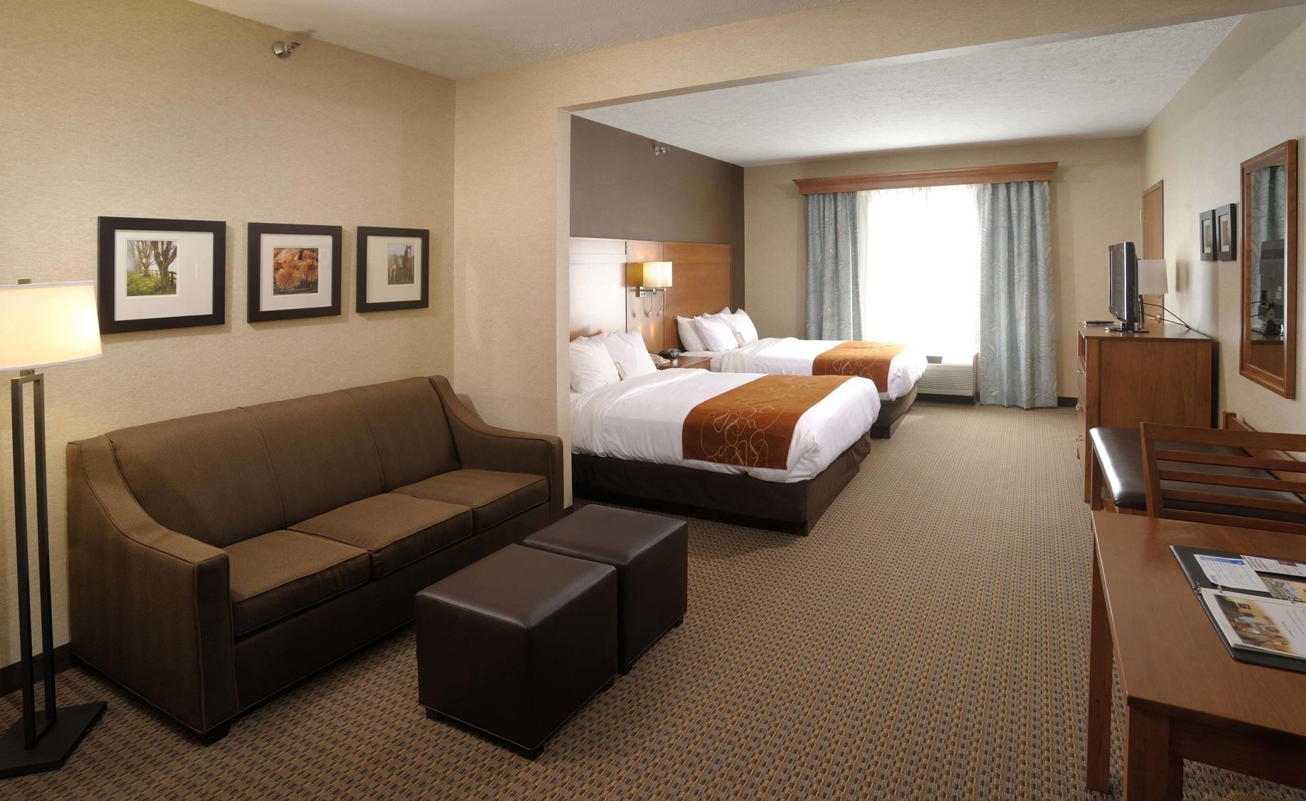 Premium bedding, laptop workspace, blackout curtains, soundproofing