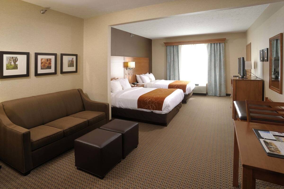 Premium bedding, laptop workspace, blackout curtains, soundproofing