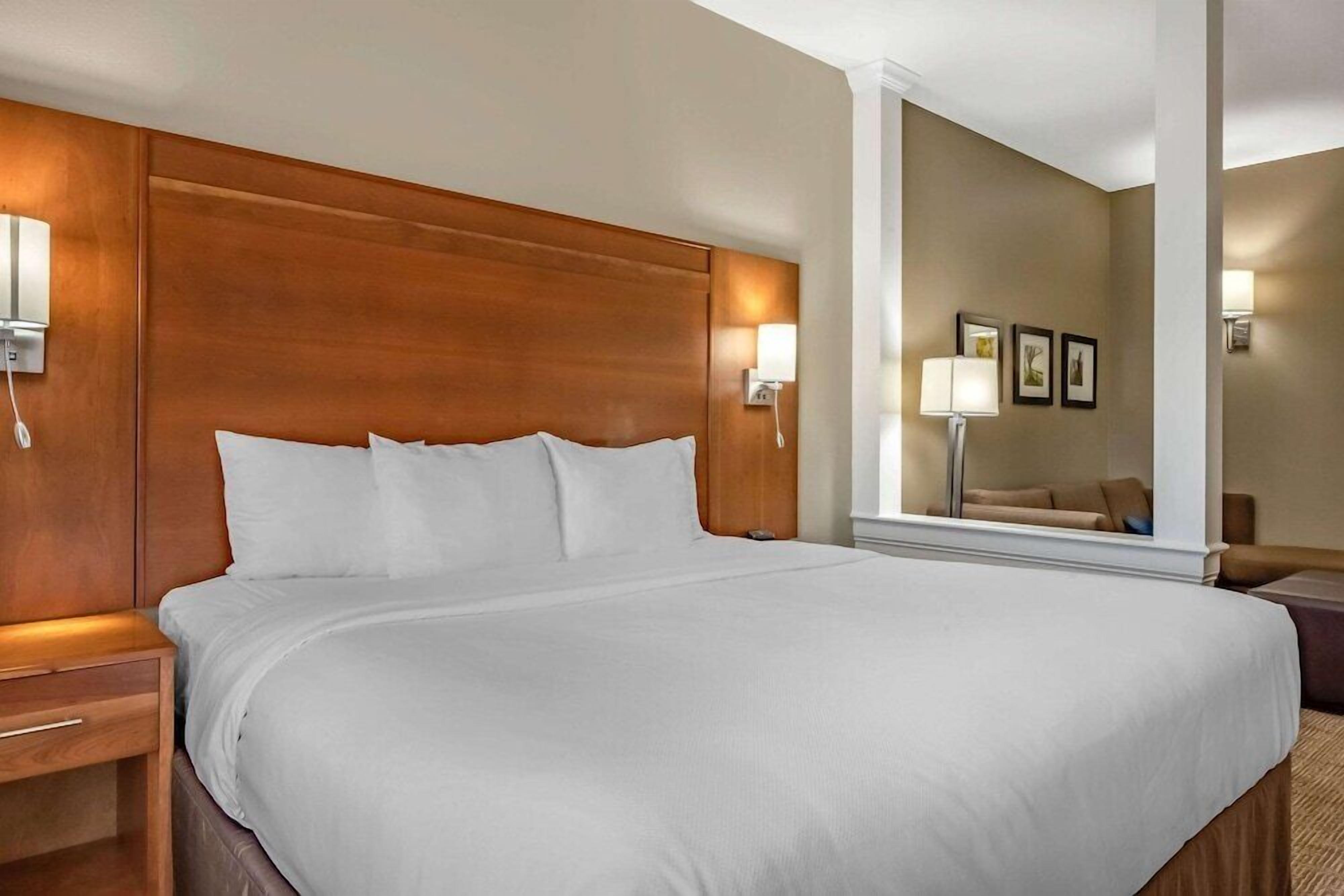 Premium bedding, laptop workspace, blackout curtains, soundproofing