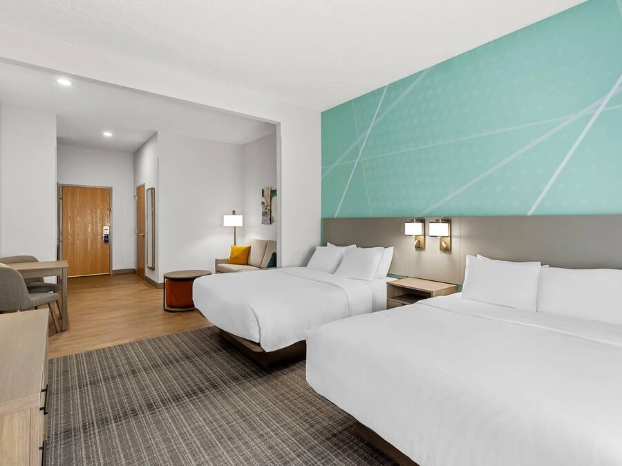 2 Queen Beds, Suite, Nonsmoking, First Floor | Premium bedding, laptop workspace, blackout curtains, soundproofing