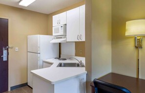 Full-size fridge, microwave, stovetop, coffee/tea maker