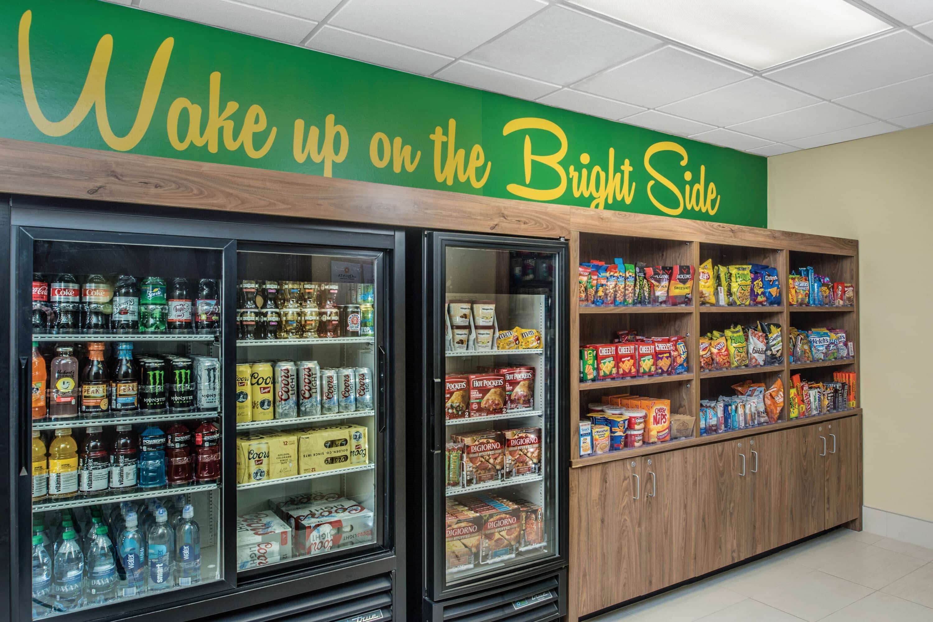 A snack and beverage display area with a 'Wake up on the Bright Side' sign above.