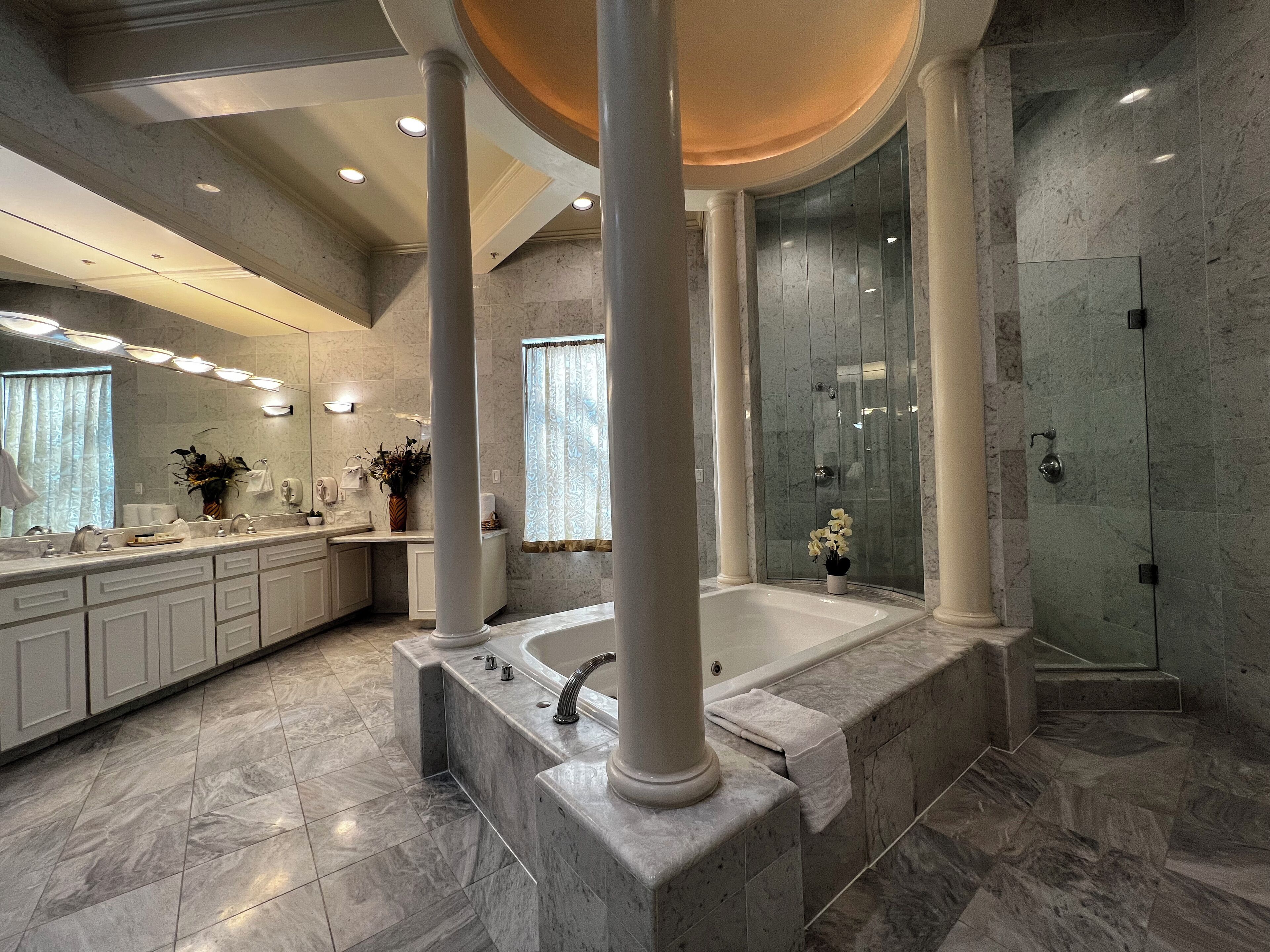 king grand suite | bathroom | combined shower/bathtub, jetted bath, free toiletries, hair dryer