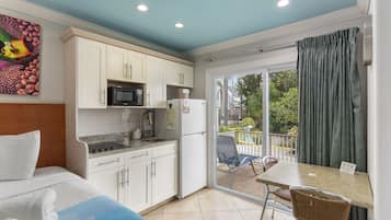 Bay Front with Balcony Suite: 2 Double Beds and 1 Sleeper Sofa | Private kitchen | Full-size fridge, microwave, stovetop, coffee/tea maker