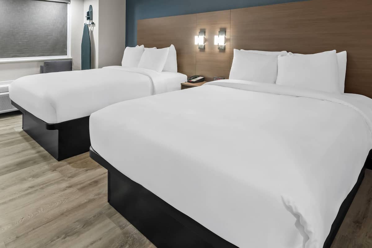 Standard Room, 2 Queen Beds, Non Smoking | In-room safe, desk, soundproofing, iron/ironing board