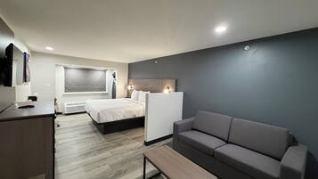 Suite, 1 King Bed with Sofa bed, Non Smoking | In-room safe, desk, soundproofing, iron/ironing board