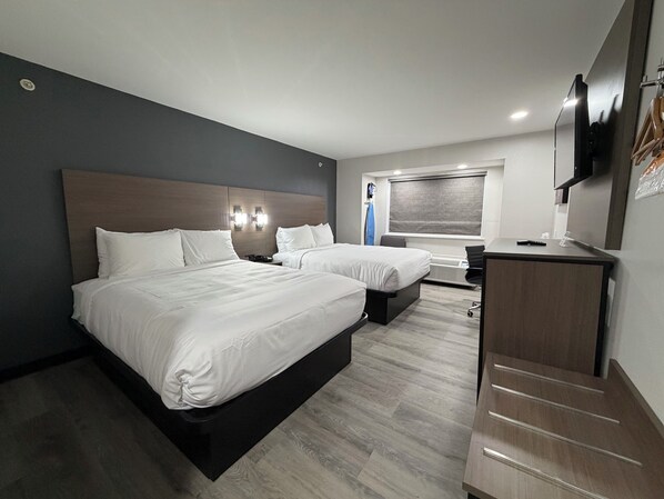 Standard Room, 2 Queen Beds, Non Smoking | In-room safe, desk, soundproofing, iron/ironing board