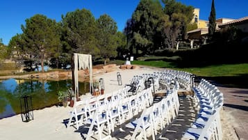 Guests can gather in this designated area surrounded by water and trees.