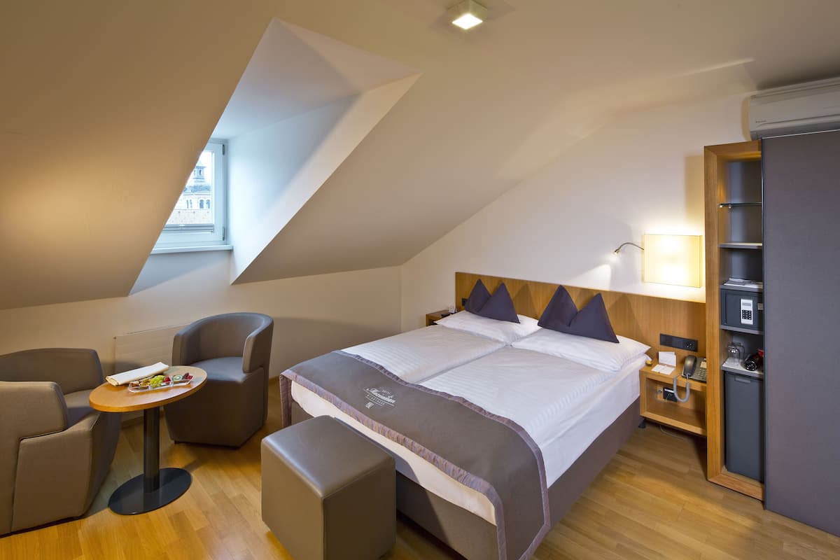 Attic Room | Hypo-allergenic bedding, minibar, in-room safe, blackout drapes