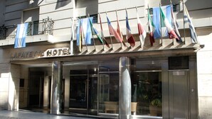 The Lafayette Hotel entrance with a modern facade, glass doors, and a metal railing. - Lafayette Hotel (Buenos Aires)