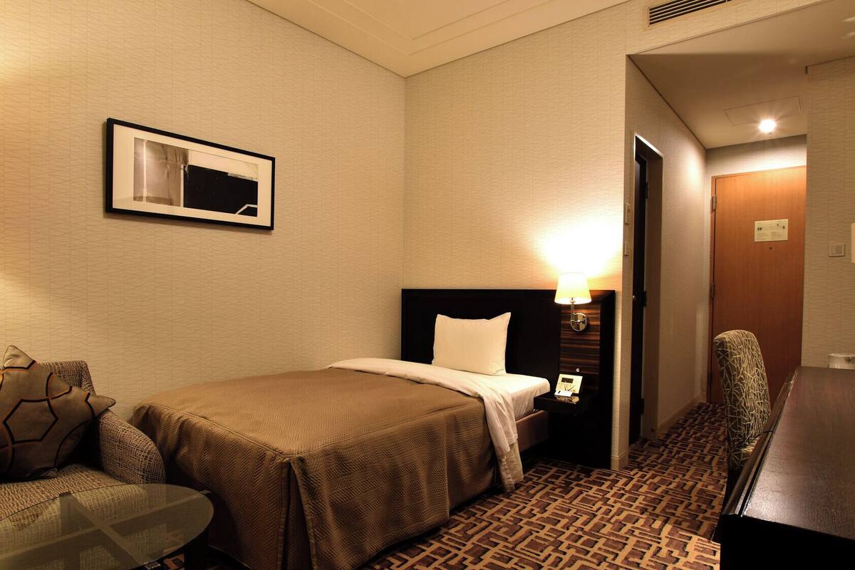 Luxe beddengoed, een kluis op de kamer, een bureau, gratis wifi
