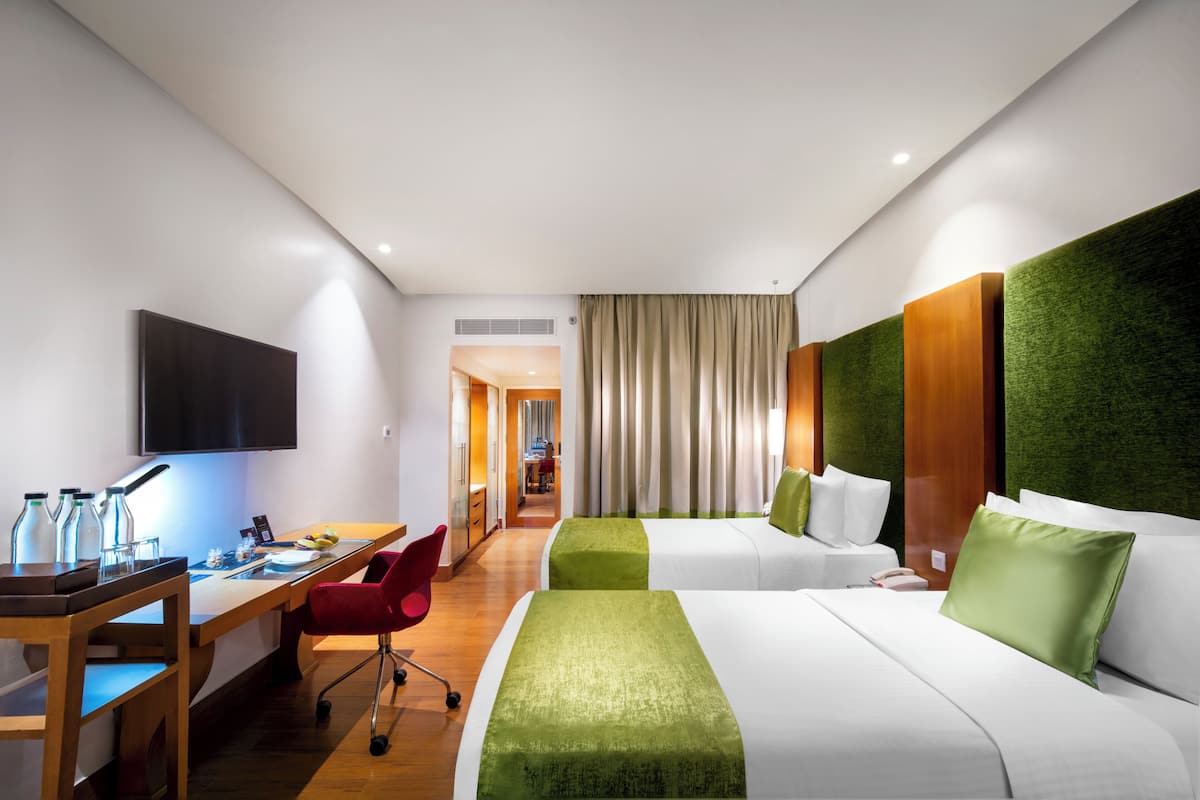 Chambre Deluxe avec lits jumeaux | Literie de qualité supérieure, minibar, coffres-forts dans les chambres