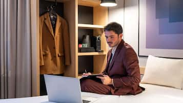 Premium bedding, desk, blackout drapes, soundproofing