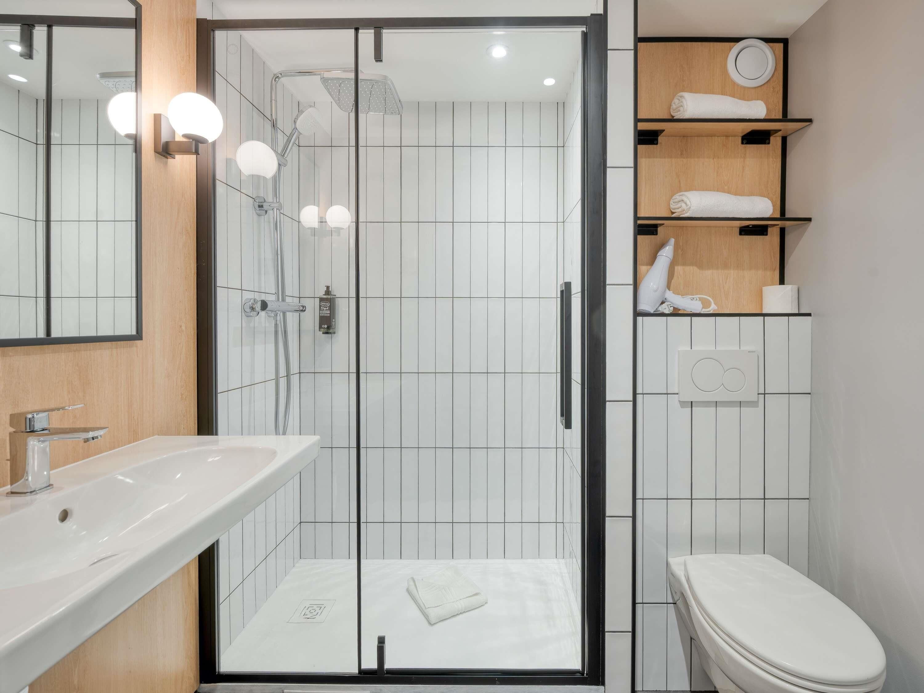 Shower, eco-friendly toiletries, hair dryer, towels