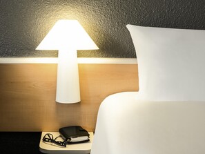 Premium bedding, desk, blackout curtains, soundproofing