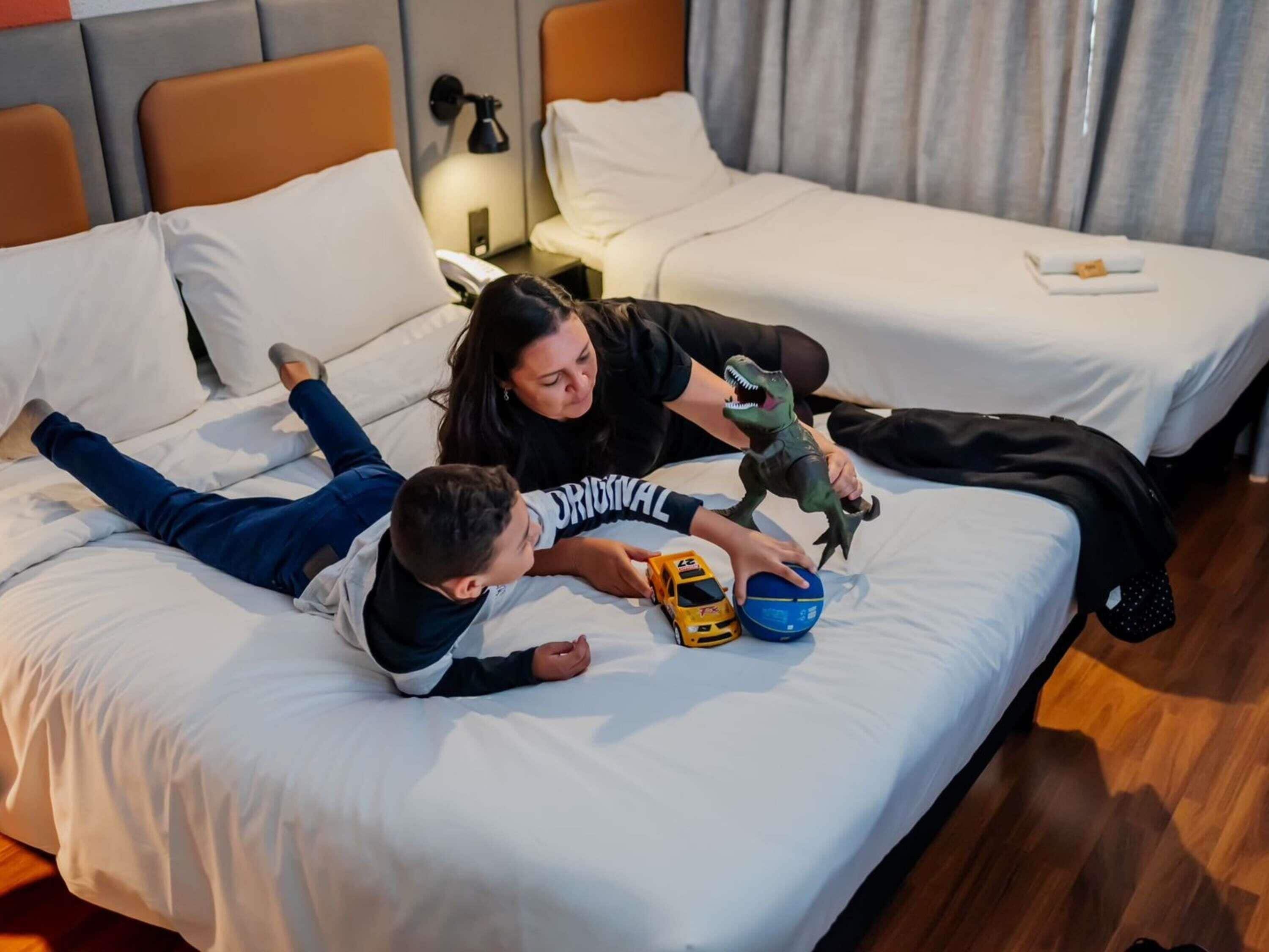 Standard Room, Multiple Beds | Minibar, in-room safe, desk, iron/ironing board