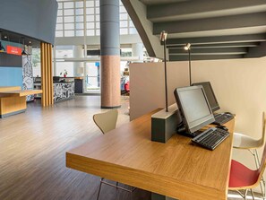 Work in comfort with a central desk and ample natural light.