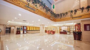 A spacious lobby with a polished marble floor, a reception desk, and a staircase leading to an upper level. - Changxin International Hotel (Lanzhou)