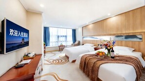 A hotel room with two beds, a TV, a desk, and a large window. - Changxin International Hotel (Lanzhou)