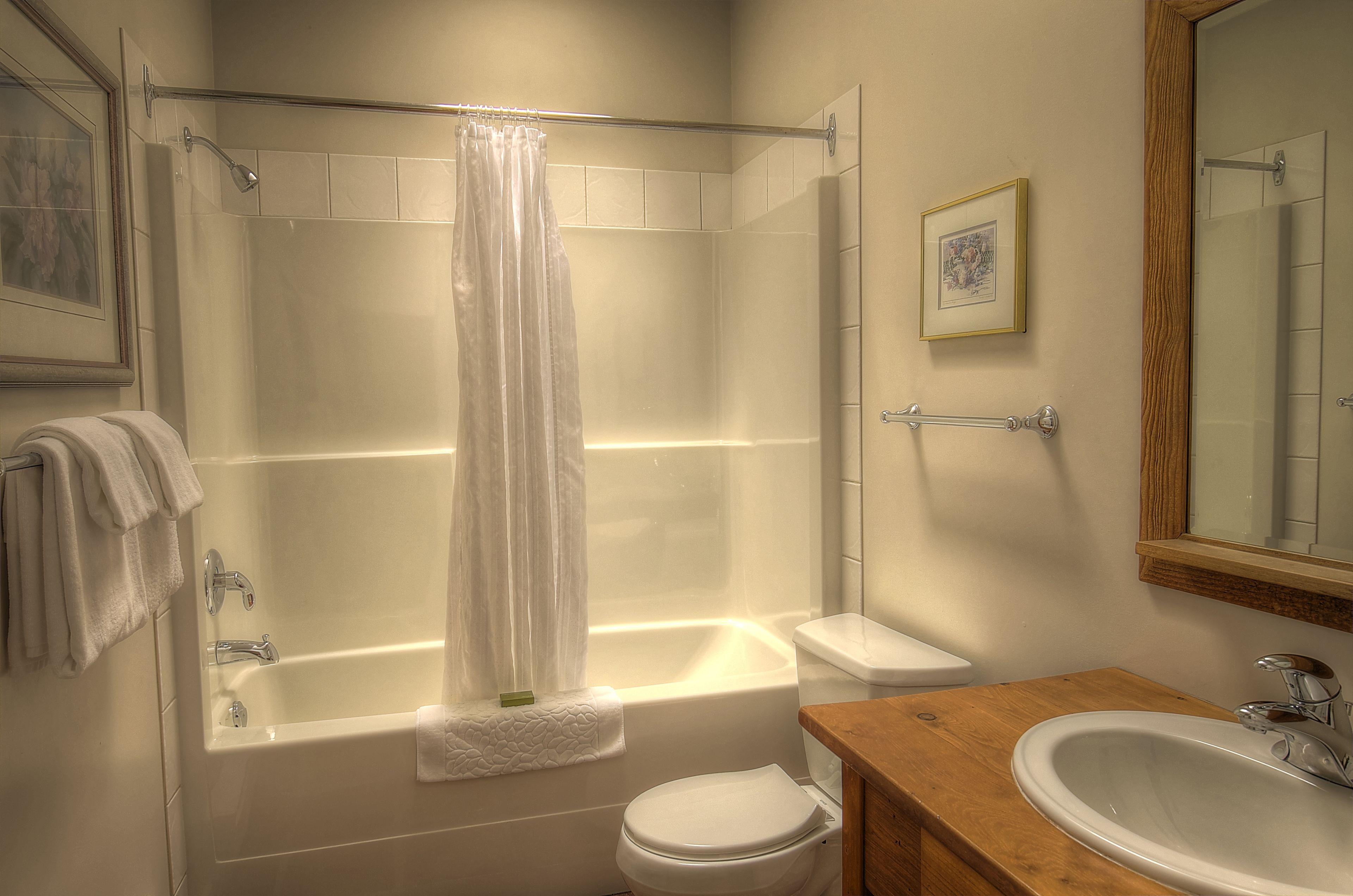 combined shower/bathtub, designer toiletries, hair dryer, bathrobes