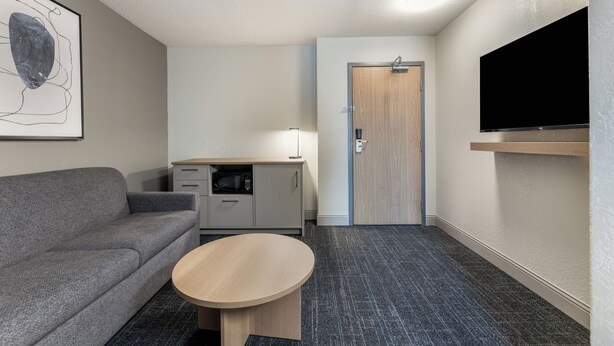 Suite, 1 King Bed, Non Smoking | Premium bedding, laptop workspace, iron/ironing board