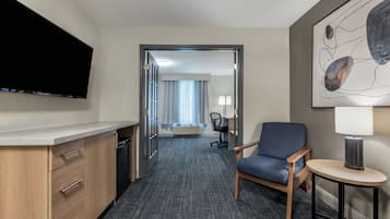 Premium bedding, laptop workspace, iron/ironing board