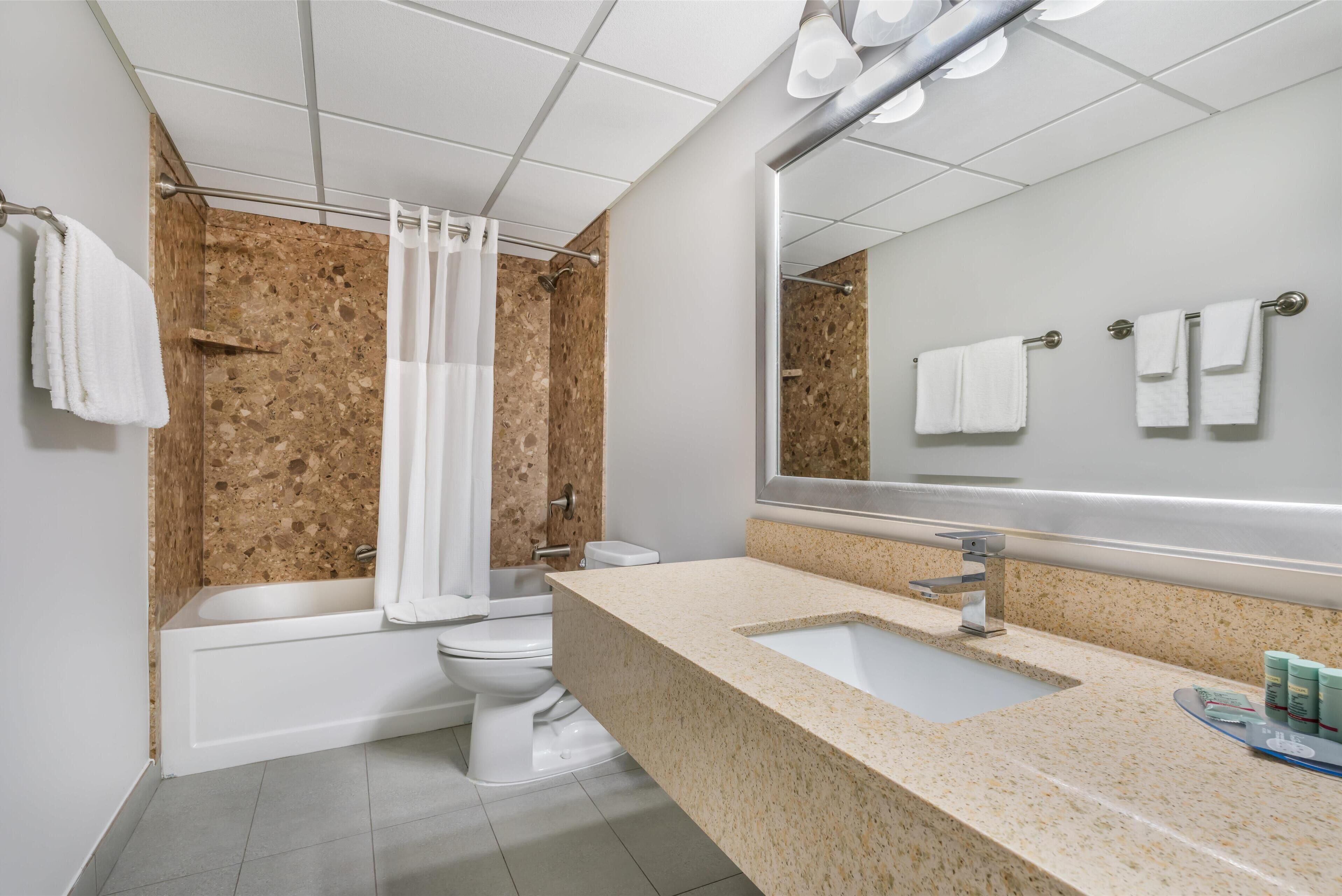 standard room, 2 queen beds, non smoking (larger room) | bathroom | combined shower/bathtub, free toiletries, hair dryer, towels