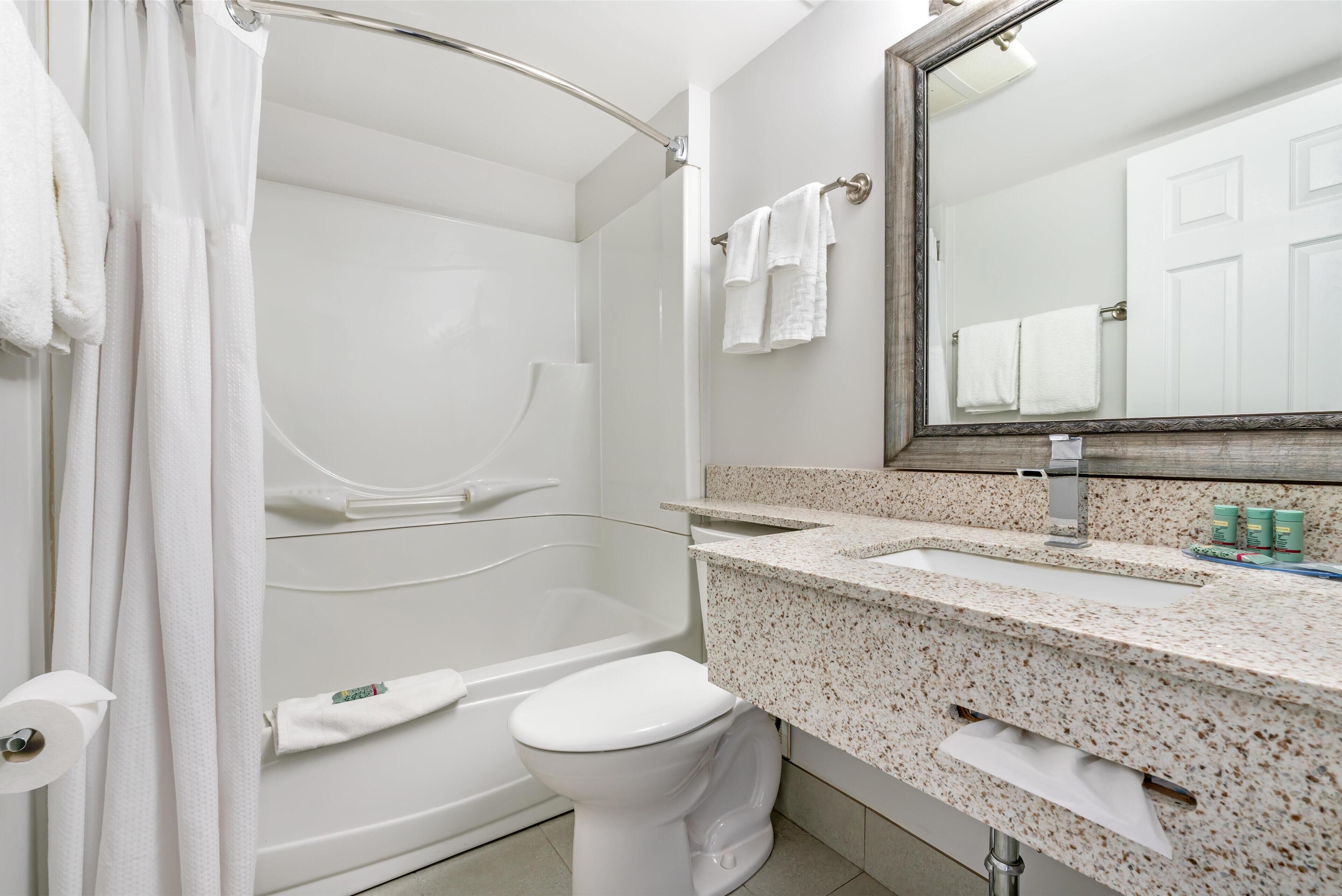 standard room, 1 king bed, non smoking, kitchenette | bathroom | combined shower/bathtub, free toiletries, hair dryer, towels