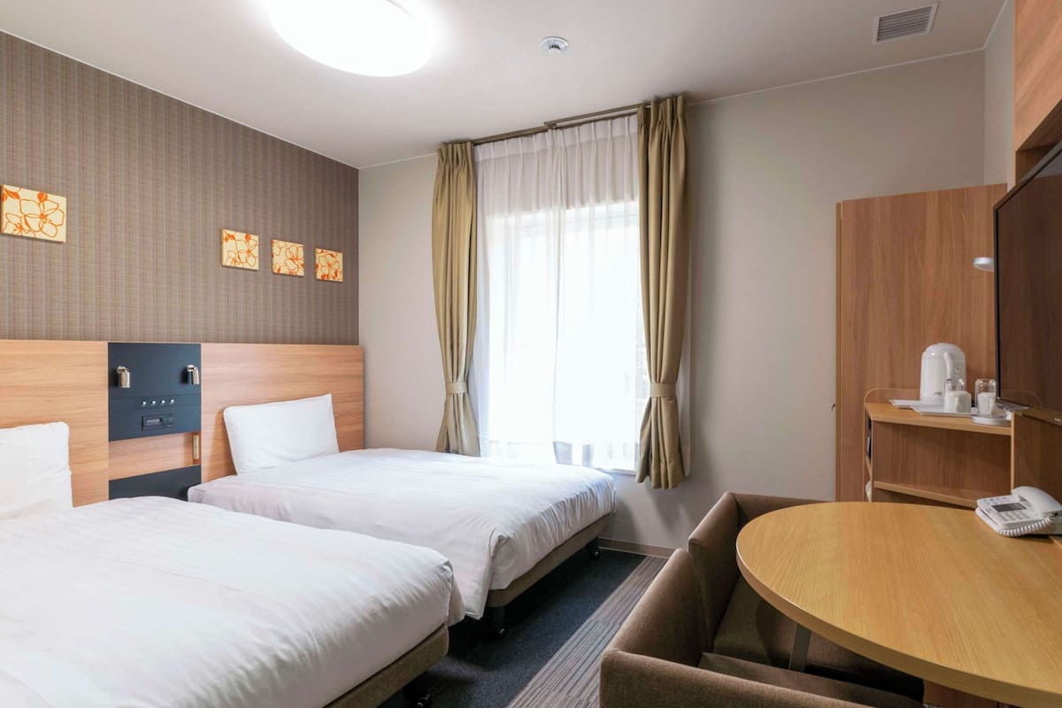 Economy Twin Room, 2 Twin Beds, Non Smoking | Desk, blackout drapes, iron/ironing board, free WiFi