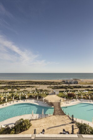 Indoor pool, outdoor pool, open 10:00 AM to 6:30 PM, pool umbrellas