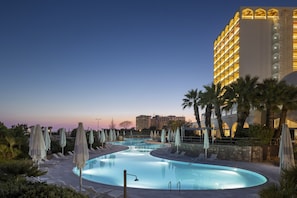 Indoor pool, outdoor pool, open 10:00 AM to 6:30 PM, pool umbrellas