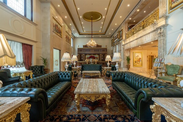 A luxurious lobby with a grand chandelier, plush seating, and ornate decor. - Radisson Hotel Jalandhar Grand Windsor Resorts Ltd (Jalandhar)