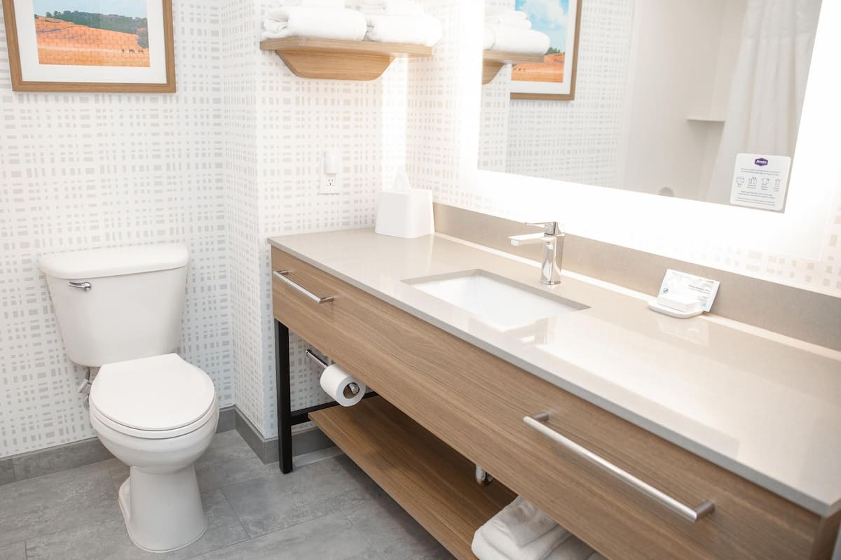 Bathtub, hair dryer, towels