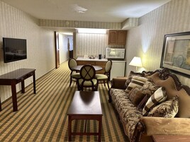 Suite, 1 King Bed, Non Smoking | Desk, laptop workspace, blackout drapes, iron/ironing board