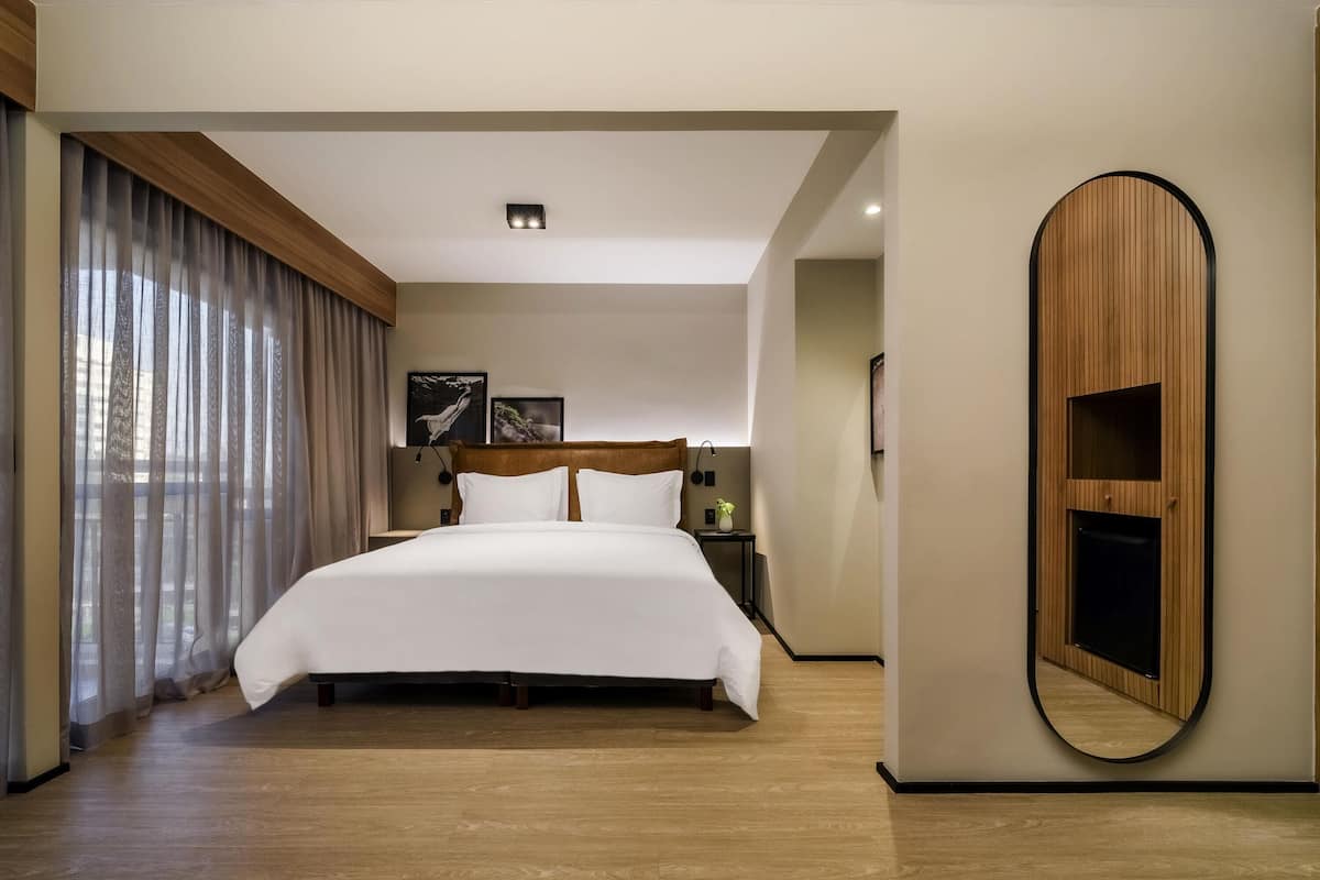 Superior Room, 1 King Bed, Balcony | Minibar, in-room safe, desk, blackout drapes