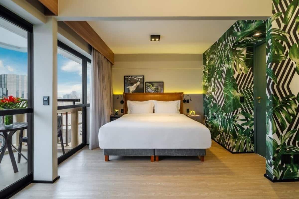 Deluxe Room, 1 King Bed, Balcony | Minibar, in-room safe, desk, blackout drapes