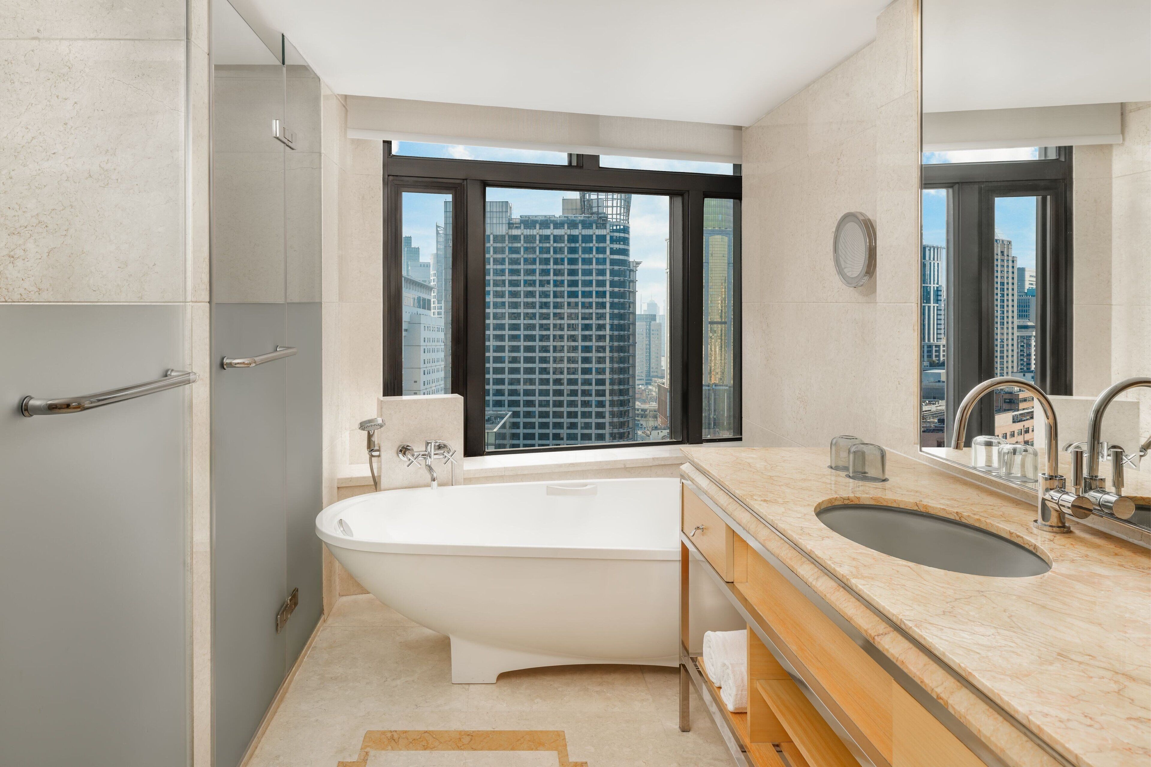 separate bathtub and shower, deep-soaking bathtub, rainfall showerhead