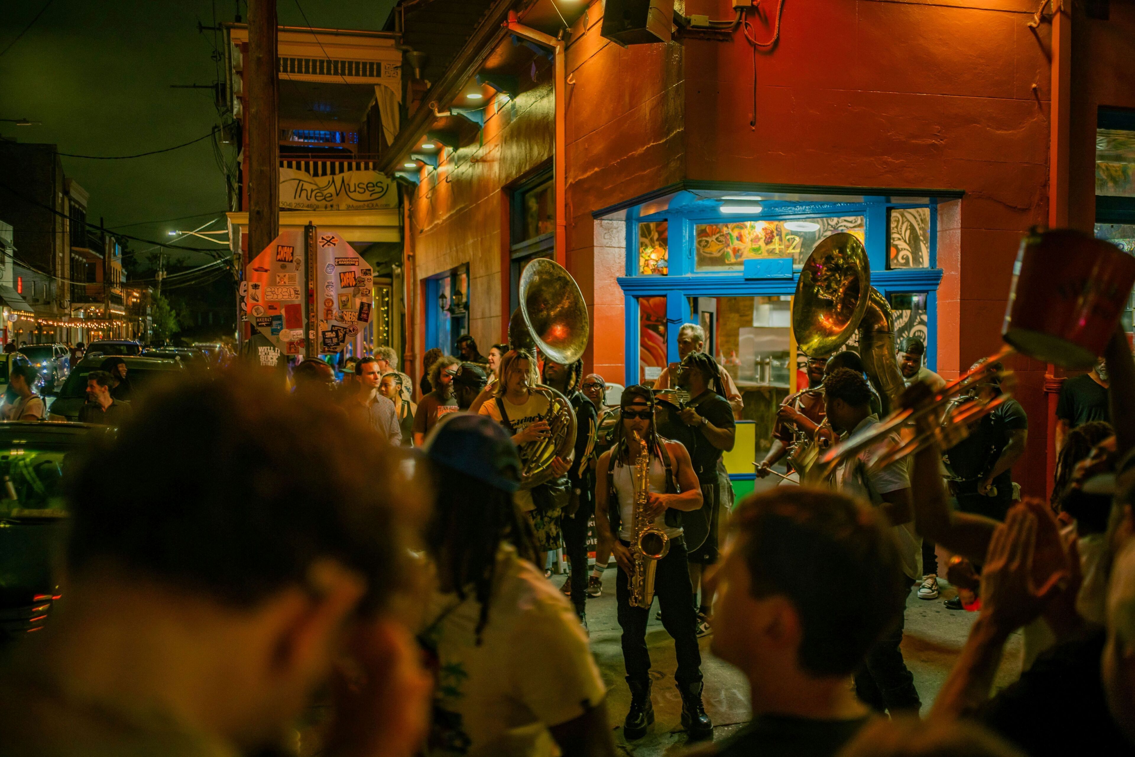 A brass band performing on a street.