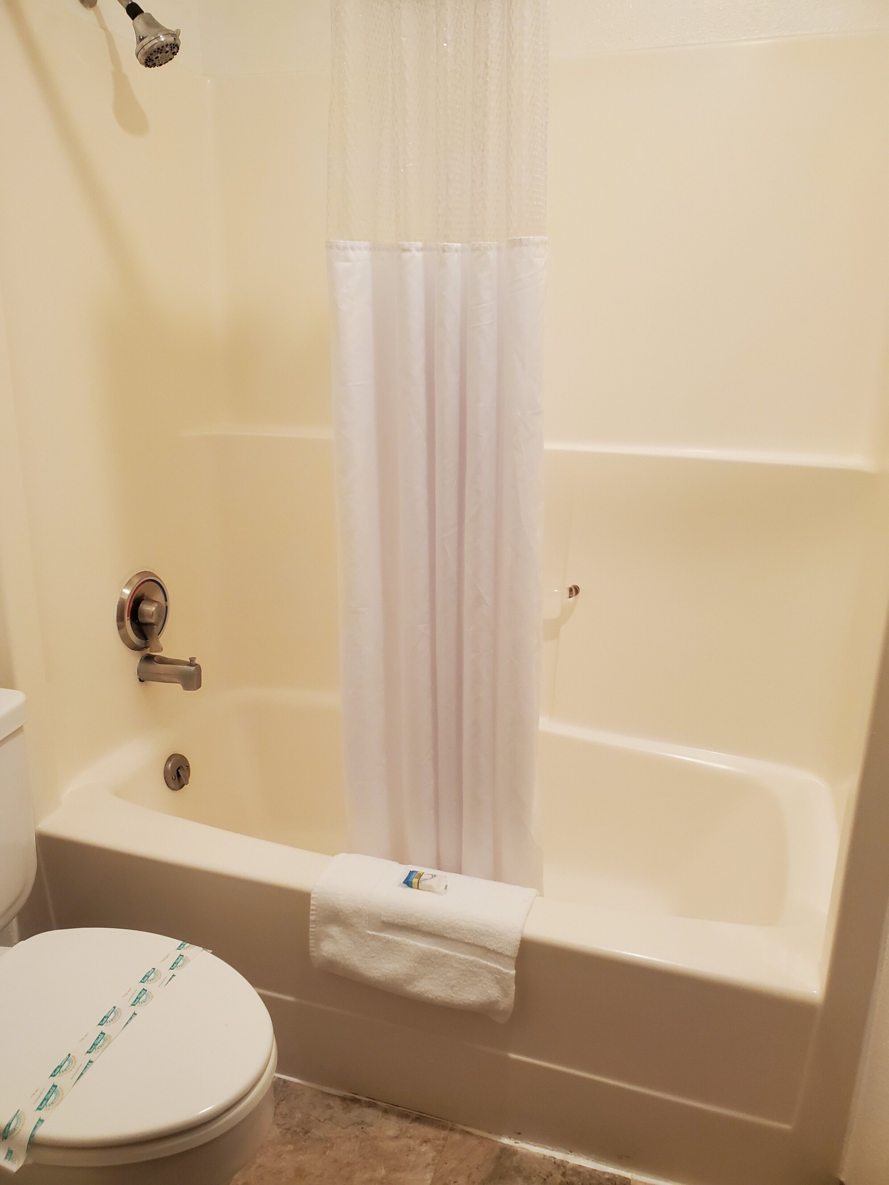 Combined shower/bathtub, hair dryer, towels, soap