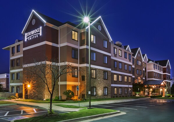 Experience the sleek entrance and convenient parking at Staybridge Suites.