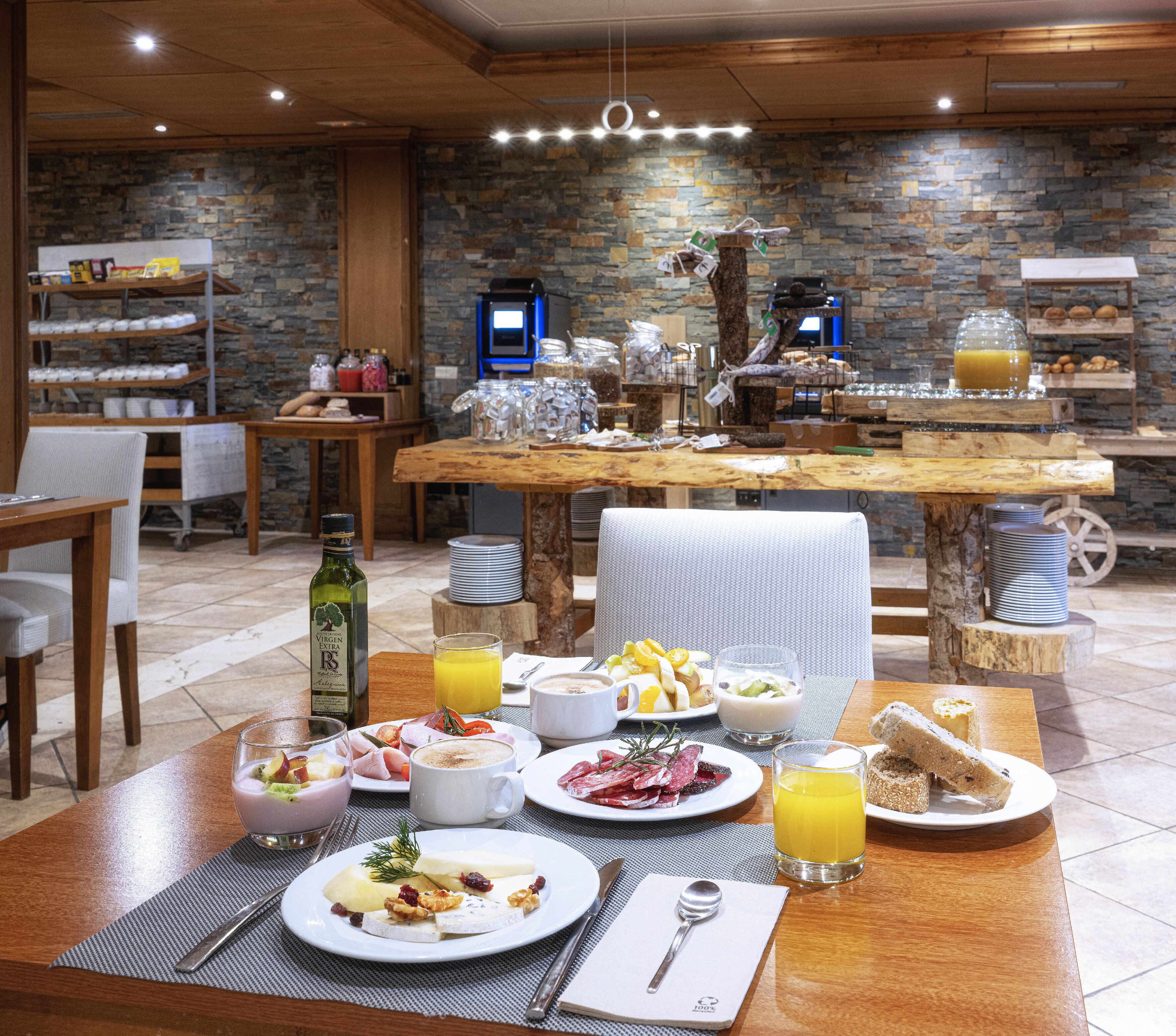 A breakfast buffet with various food items and beverages.