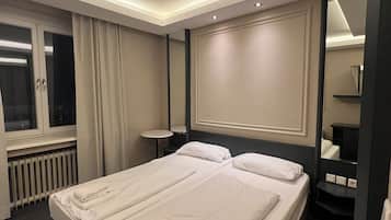 Ropa de cama de alta calidad, edredón, camas con pillow-top y minibar