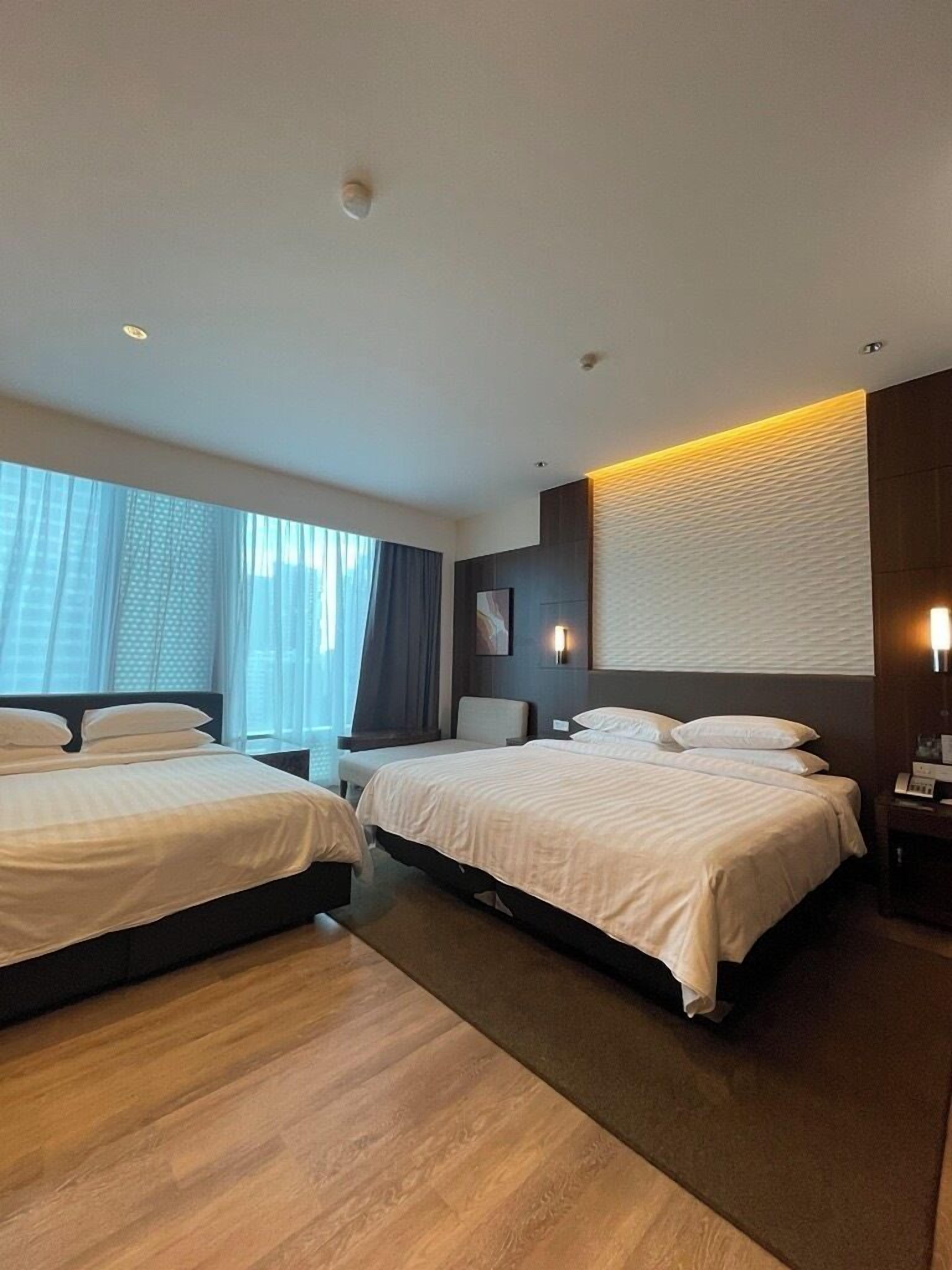 deluxe room (family) | in-room safe, desk, blackout curtains, iron/ironing board