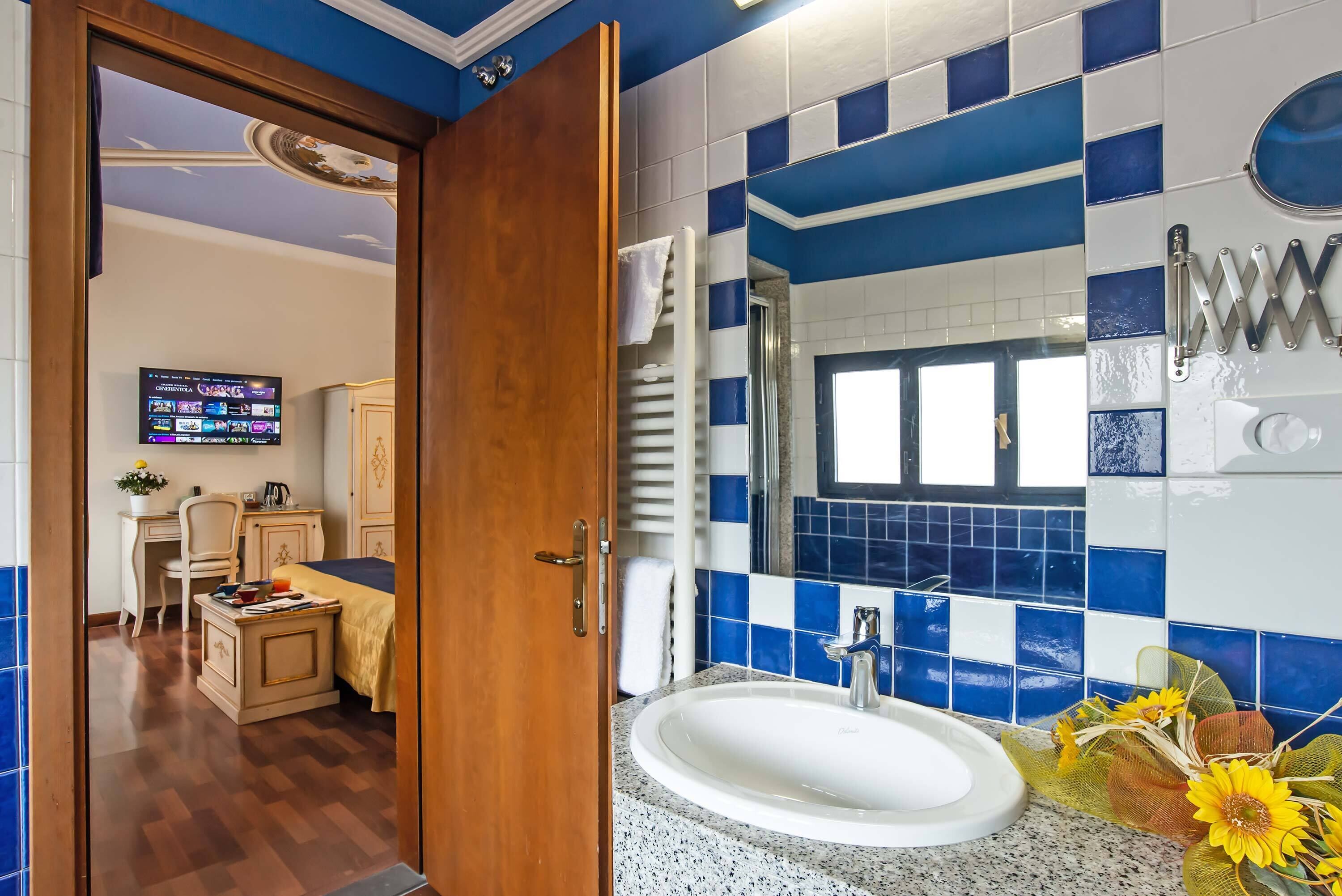 superior double room | bathroom | free toiletries, hair dryer, towels