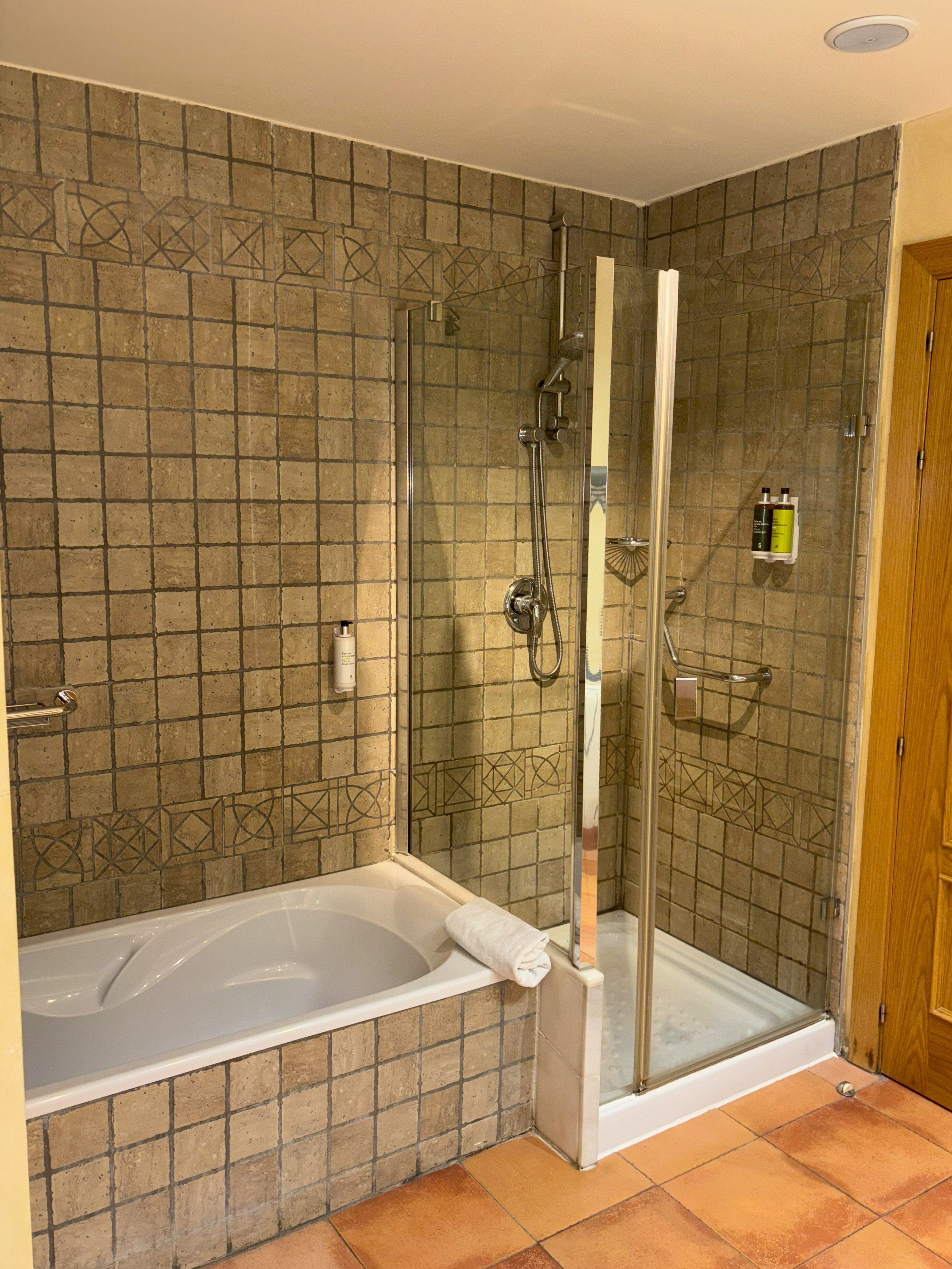 bathtub, free toiletries, hair dryer, towels