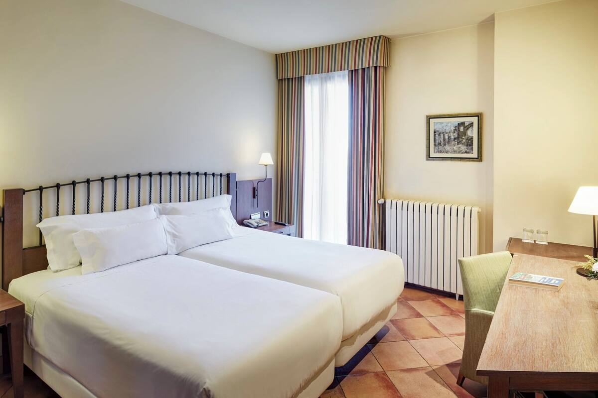 classic twin room | minibar, in-room safe, desk, blackout curtains